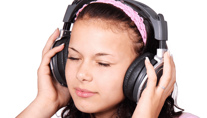 Girl with headphone listening to music